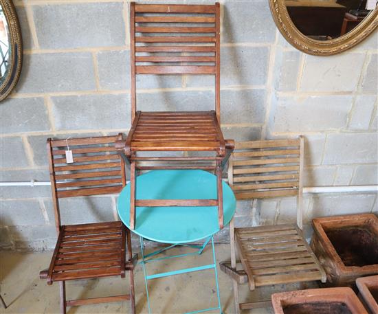 A folding garden table and three wooden chairs, table width 60cm, depth 60cm, height 71cm